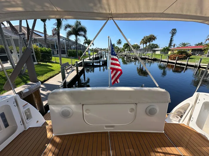  Yacht Photos Pics 2005 Tiara Yachts 3600 Sovran docked, featuring teak deck and American flag.