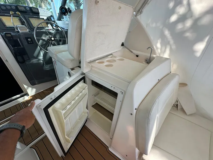  Yacht Photos Pics 2005 Tiara Yachts 3600 Sovran interior with open fridge and helm station.