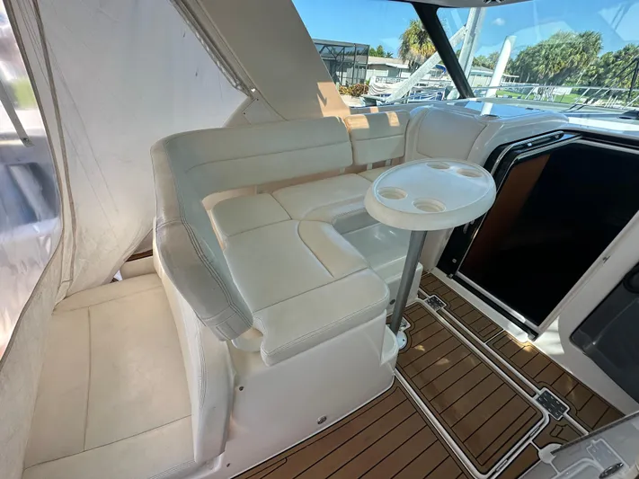  Yacht Photos Pics 2005 Tiara Yachts 3600 Sovran interior with white seating and wooden flooring.