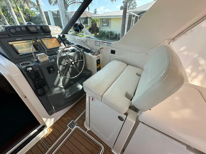  Yacht Photos Pics 2005 Tiara Yachts 3600 Sovran helm with steering wheel and navigation controls.