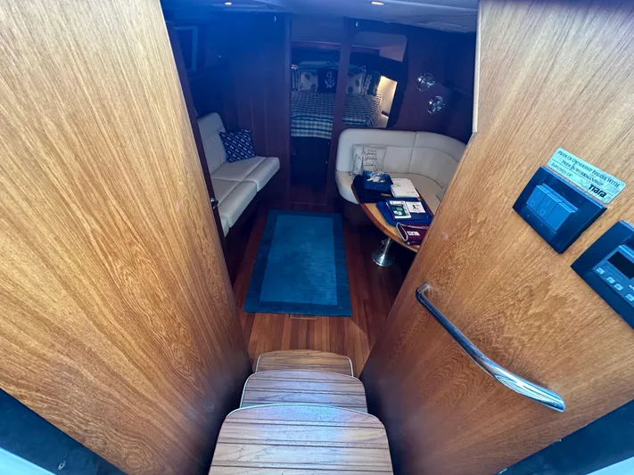  Yacht Photos Pics Interior of 2005 Tiara Yachts 3600 Sovran, featuring cozy seating and wooden finishes.