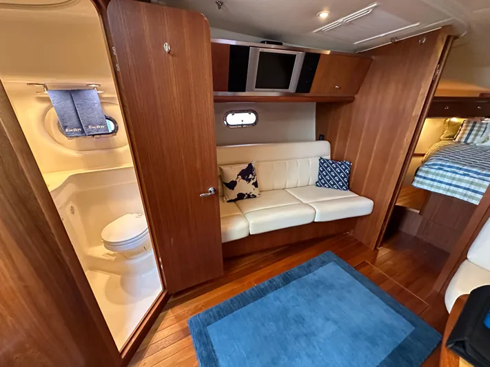  Yacht Photos Pics 2005 Tiara Yachts 3600 Sovran interior with sofa, bathroom, and bed.