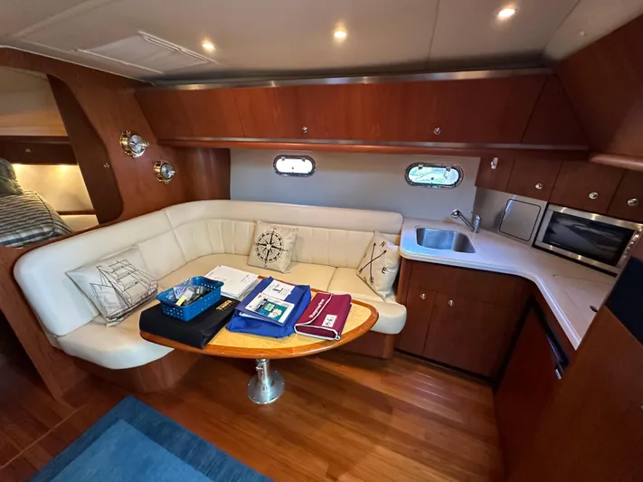  Yacht Photos Pics Interior of 2005 Tiara Yachts 3600 Sovran with cozy seating and kitchenette.