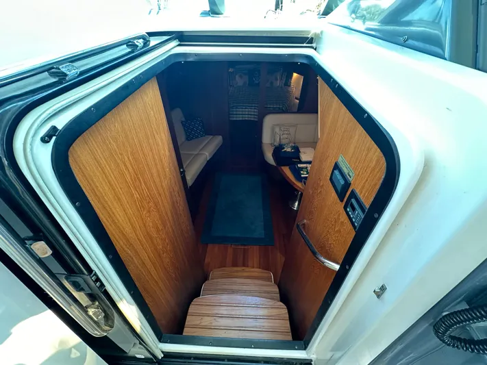  Yacht Photos Pics Interior view of 2005 Tiara Yachts 3600 Sovran cabin with wooden finishes.