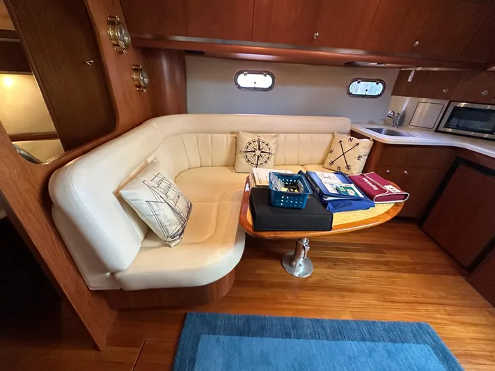  Yacht Photos Pics Interior of 2005 Tiara Yachts 3600 Sovran with cozy seating and wooden accents.