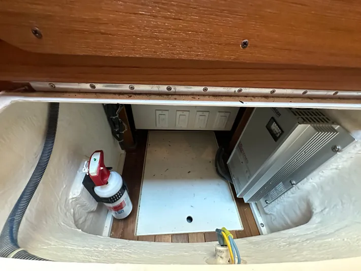  Yacht Photos Pics 2005 Tiara Yachts 3600 Sovran storage compartment with fire extinguisher and electrical equipment.