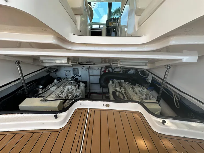  Yacht Photos Pics Engine compartment of 2005 Tiara Yachts 3600 Sovran with twin engines and teak flooring.