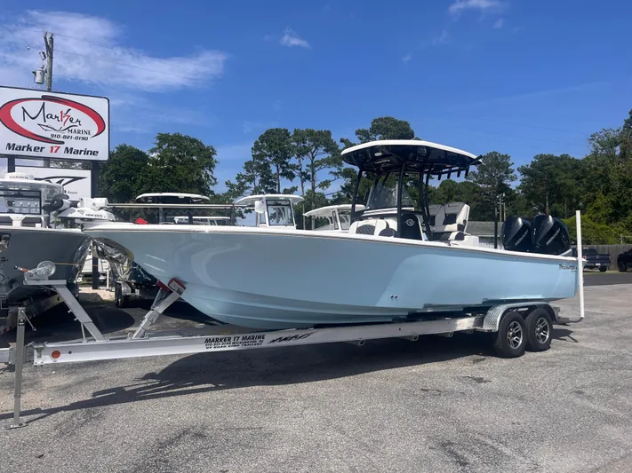  Yacht Photos Pics 2023 Tidewater 2700 Carolina Bay boat on trailer at Marker 17 Marine dealership.