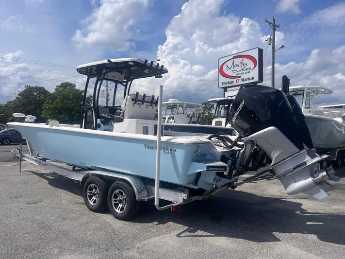  Yacht Photos Pics 2023 Tidewater 2700 Carolina Bay boat on trailer, displayed outdoors under cloudy sky.