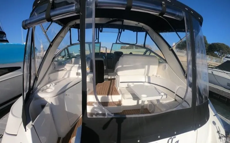 Grand Cru Yacht Photos Pics 2005 Cruisers Yachts 340 Express with enclosed cockpit and seating area, docked at marina.