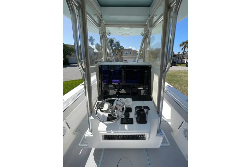 New Fuel Tanks Yacht Photos Pics 2008 Contender 27 Tournament boat console with steering wheel and controls.