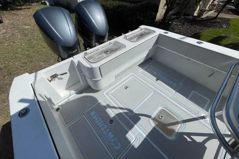 New Fuel Tanks Yacht Photos Pics 2008 Contender 27 Tournament boat deck with twin 300 engines, featuring storage compartments.