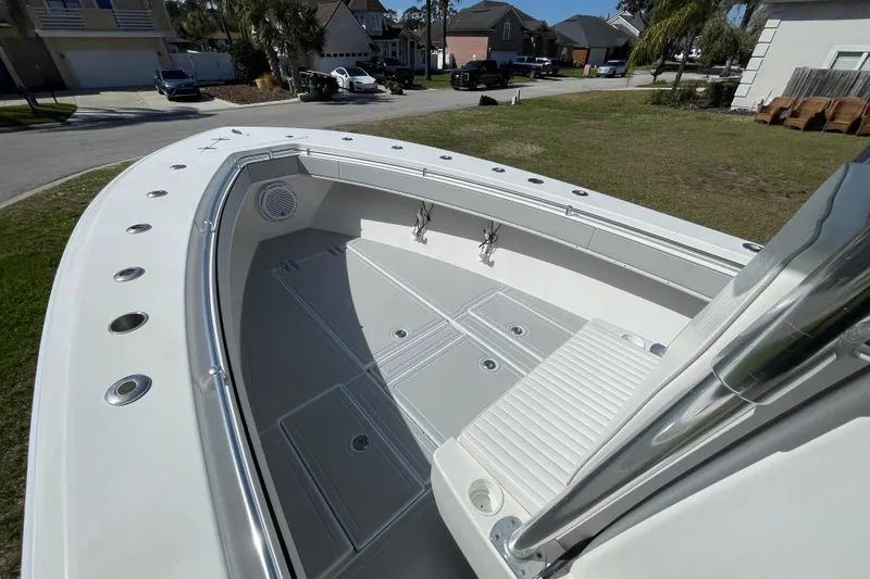 New Fuel Tanks Yacht Photos Pics 2008 Contender 27 Tournament boat deck with seating and storage compartments.