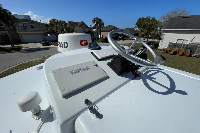 New Fuel Tanks Yacht Photos Pics 2008 Contender 27 Tournament boat helm with Simrad electronics and steering wheel.