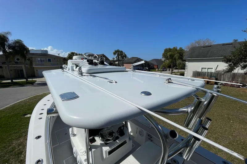 New Fuel Tanks Yacht Photos Pics 2008 Contender 27 Tournament boat with sleek design, parked in a residential area.