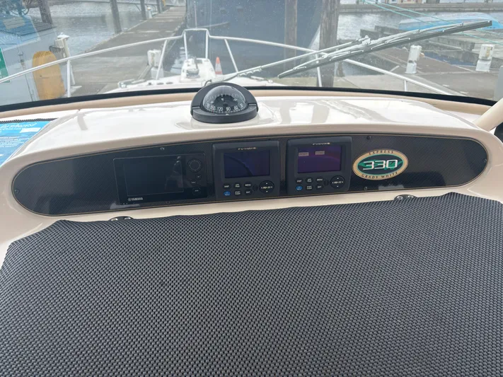  Yacht Photos Pics Dashboard of a 2014 Grady-White Express 330 boat with navigation instruments.