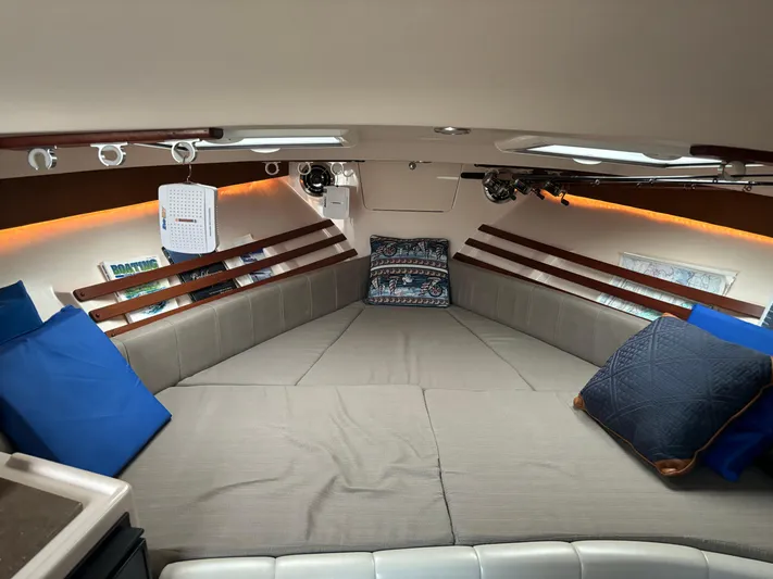 Yacht Photos Pics 2014 Grady-White Express 330 cabin interior with cushions and ambient lighting.