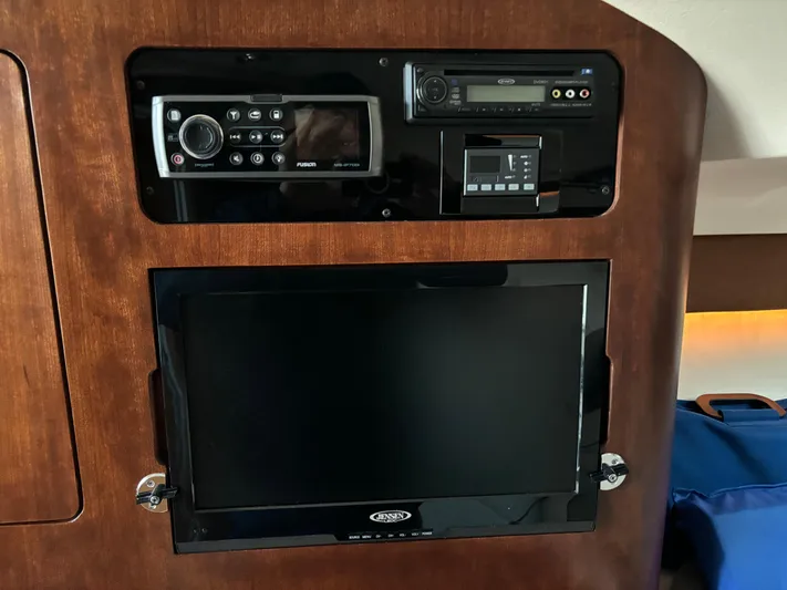  Yacht Photos Pics 2014 Grady-White Express 330 cabin electronics panel with radio and TV screen.