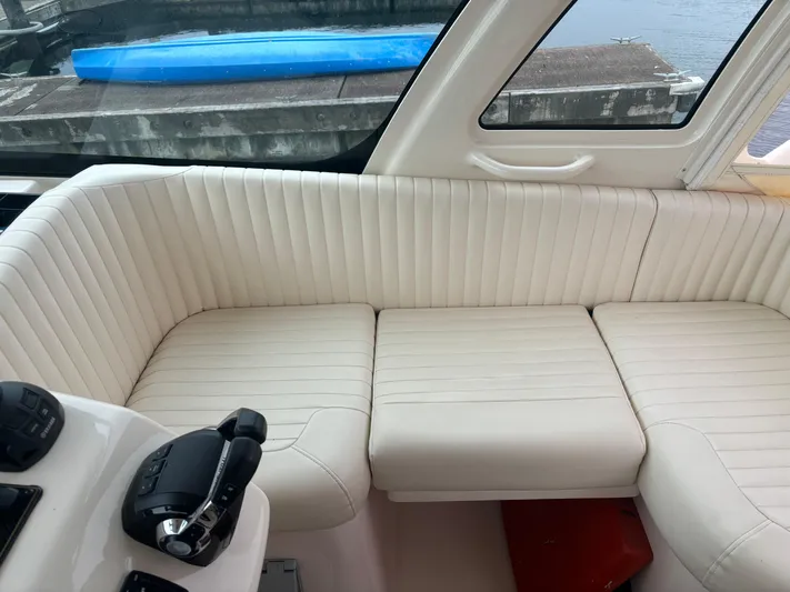  Yacht Photos Pics Luxurious white seating on 2014 Grady-White Express 330 boat interior.