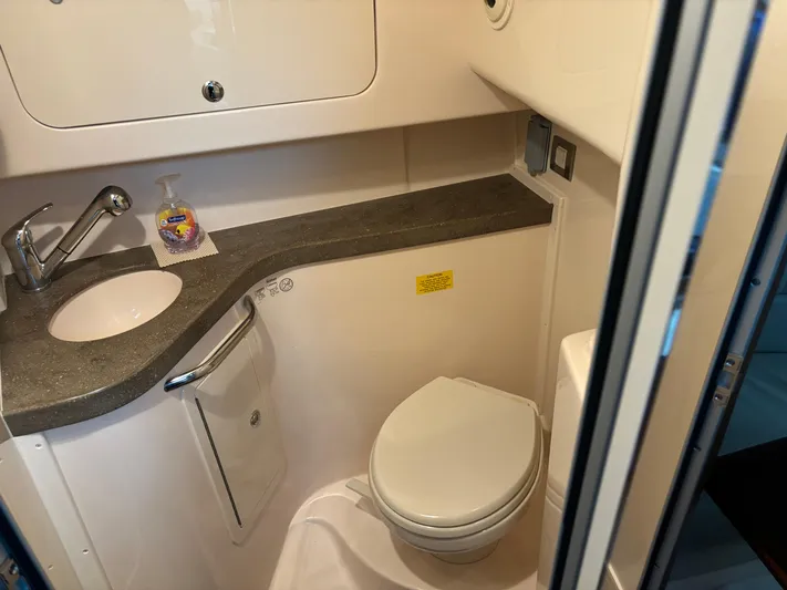  Yacht Photos Pics 2014 Grady-White Express 330 boat bathroom with sink, toilet, and countertop.