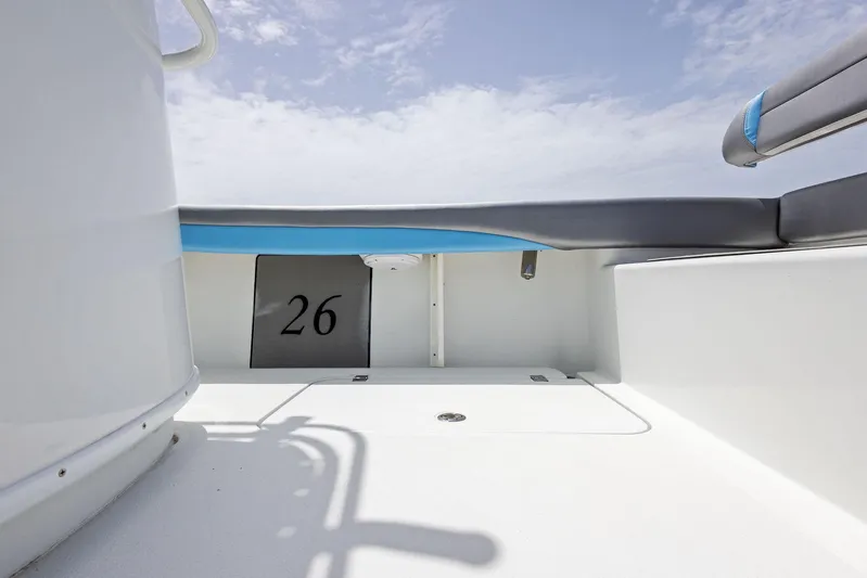 Yacht Photos Pics 2016 Yellowfin 26 Hybrid boat interior with seating and storage.