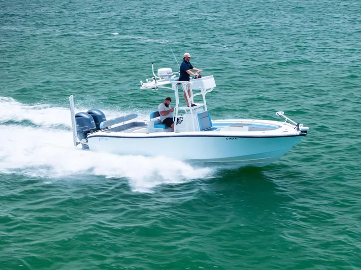  Yacht Photos Pics 2016 Yellowfin 26 Hybrid boat cruising on open water.