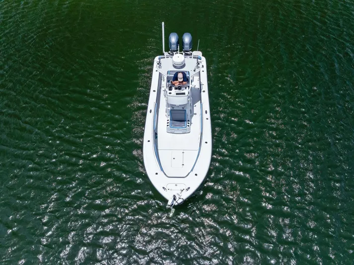  Yacht Photos Pics Aerial view of 2016 Yellowfin 26 Hybrid boat on green water.