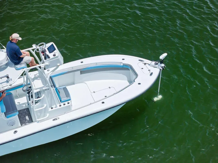  Yacht Photos Pics 2016 Yellowfin 26 Hybrid boat on green water, aerial view.
