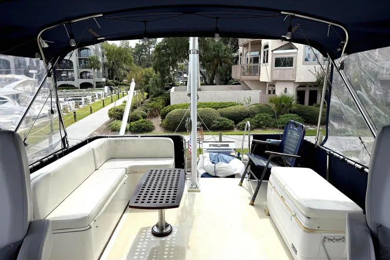 Summer Wind Yacht Photos Pics Interior view of 1989 Grand Banks 46 Classic yacht with seating and table.