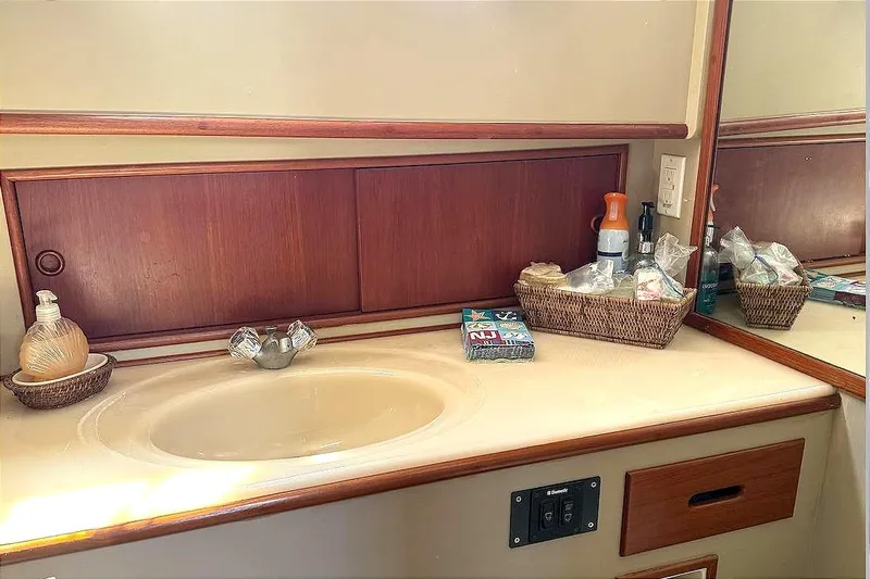 Summer Wind Yacht Photos Pics Bathroom vanity on a 1989 Grand Banks 46 Classic yacht with wooden accents.