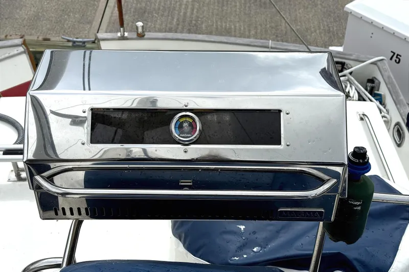 Summer Wind Yacht Photos Pics Stainless steel Magma grill on 1989 Grand Banks 46 Classic yacht deck.