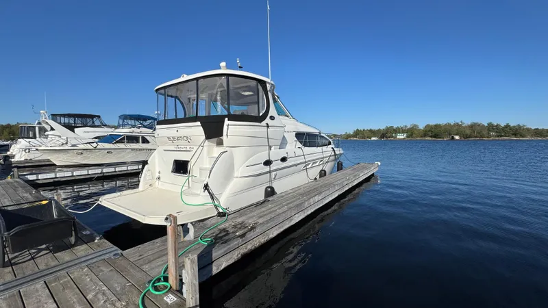  Yacht Photos Pics 2005 Sea Ray 390 Motor Yacht docked at marina on a sunny day.