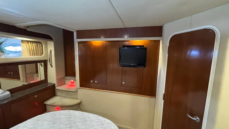  Yacht Photos Pics Interior of 2005 Sea Ray 390 Motor Yacht with wood paneling and compact TV.