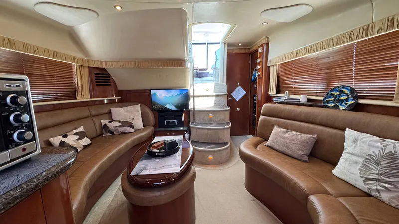  Yacht Photos Pics Luxurious interior of 2005 Sea Ray 390 Motor Yacht with plush seating and modern amenities.