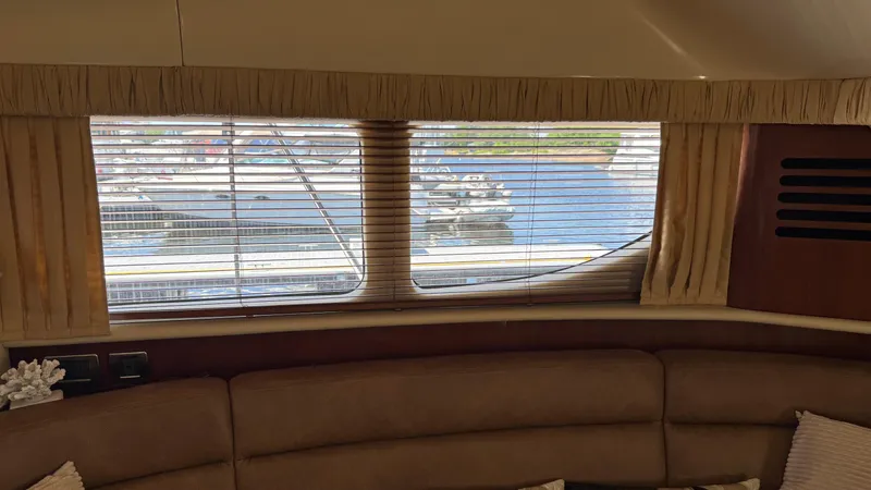  Yacht Photos Pics Interior view of 2005 Sea Ray 390 Motor Yacht with window blinds and marina view.