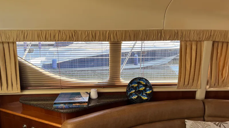  Yacht Photos Pics Interior view of 2005 Sea Ray 390 Motor Yacht with window blinds and decorative items.