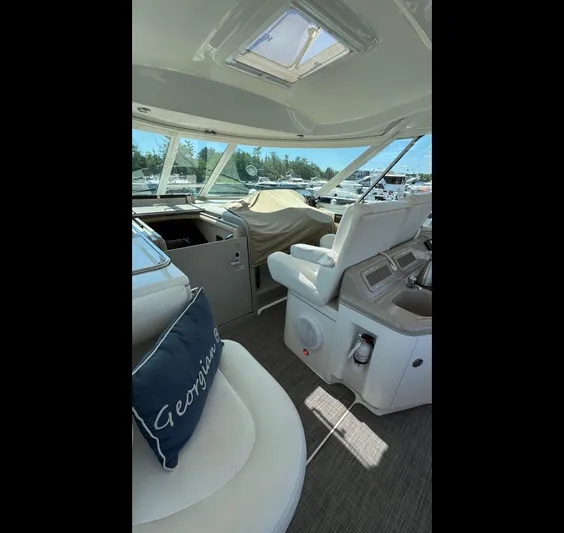  Yacht Photos Pics 2005 Sea Ray 390 Motor Yacht interior with helm, seating, and panoramic windows.