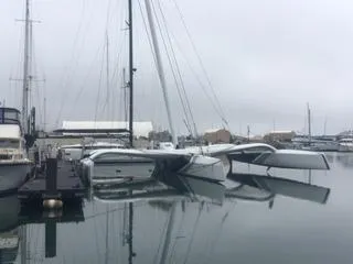  Yacht Photos Pics MOD70 trimaran by CDK Technologies, 2011, docked in a calm marina.