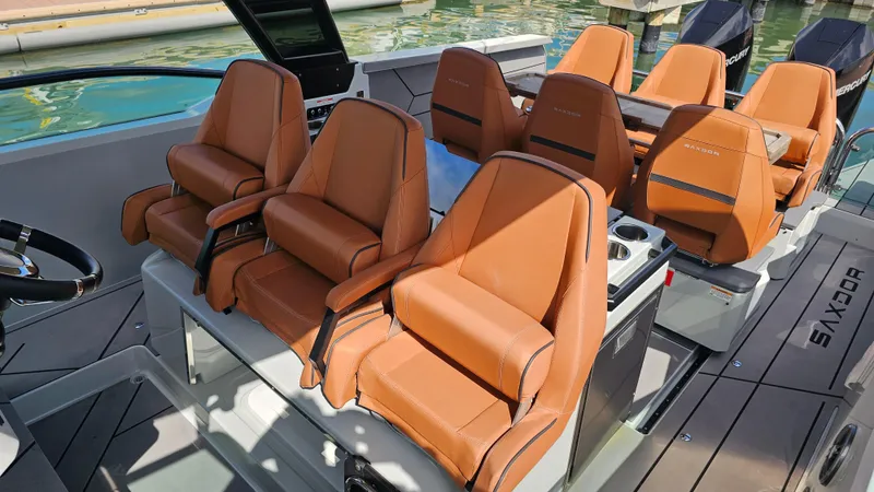  Yacht Photos Pics 2023 Saxdor 320 GTO boat interior with luxurious tan leather seating.