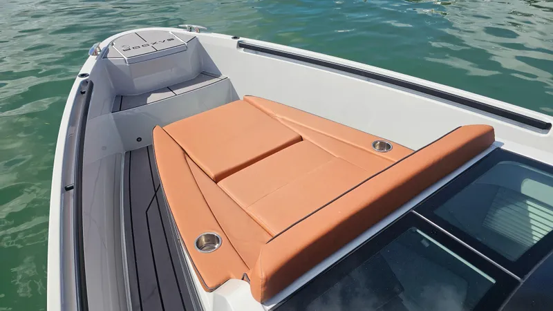  Yacht Photos Pics 2023 Saxdor 320 GTO boat with tan seating, on calm water.