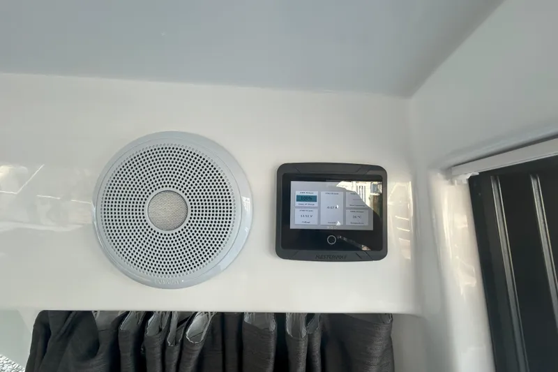  Yacht Photos Pics 2024 Beneteau Antares 9 interior with speaker and control panel.