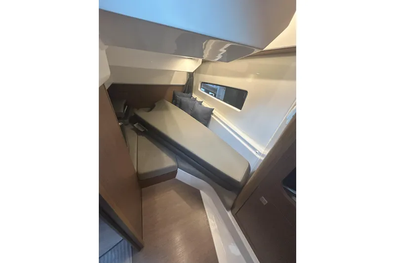  Yacht Photos Pics 2024 Beneteau Antares 9 cabin interior with modern design and comfortable seating.