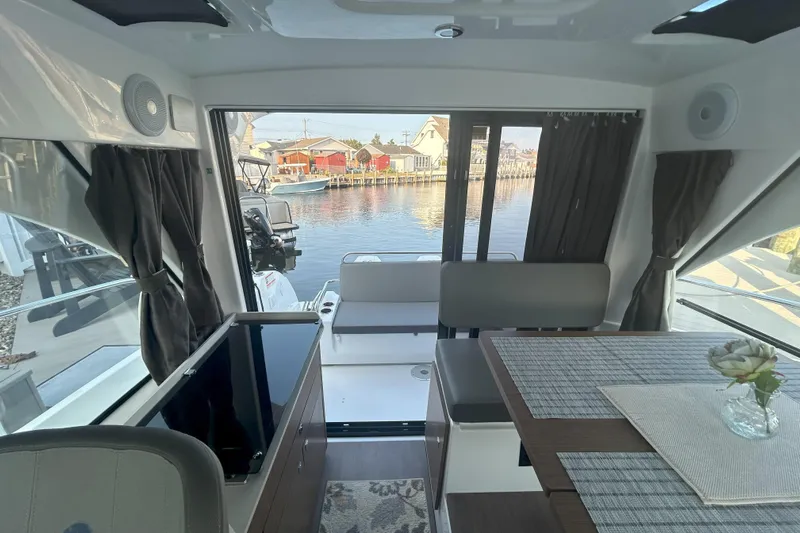  Yacht Photos Pics Interior of 2024 Beneteau Antares 9, featuring modern design and waterfront view.