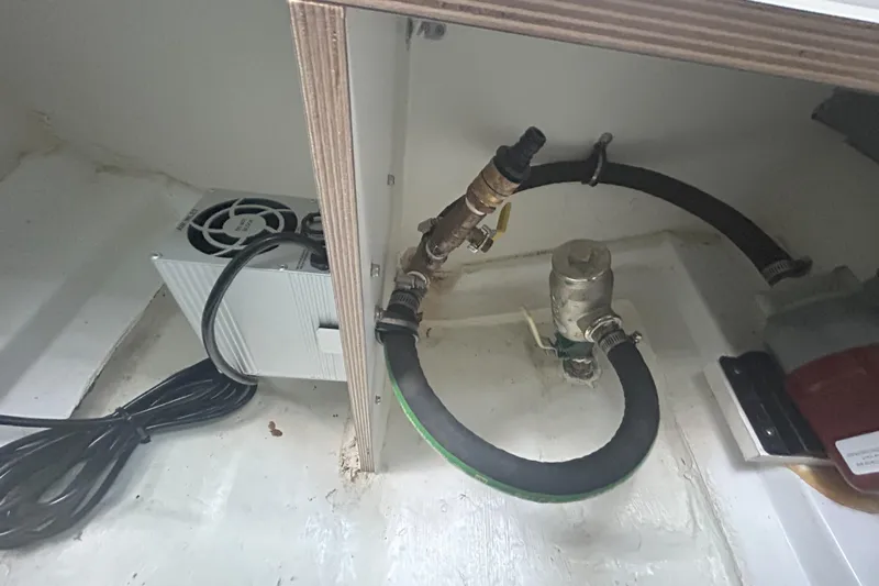  Yacht Photos Pics 2024 Beneteau Antares 9 engine compartment with hoses and electrical components.