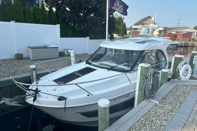  Yacht Photos Pics 2024 Beneteau Antares 9 docked, featuring sleek design and modern amenities.