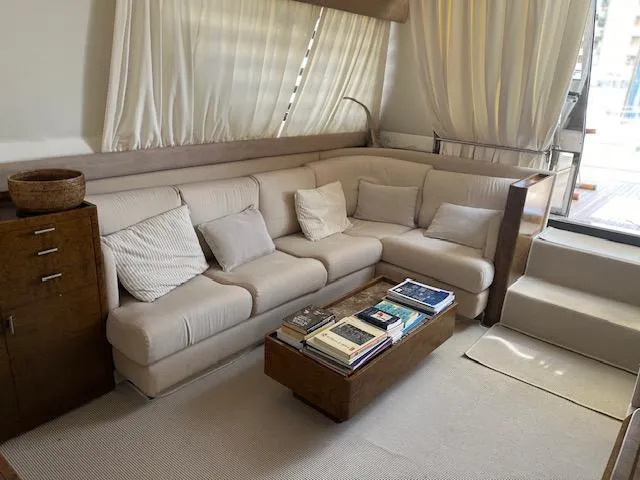  Yacht Photos Pics Luxurious interior of 1990 Riva Corsaro 20 yacht with plush seating and elegant decor.