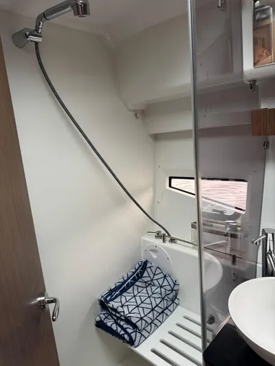  Yacht Photos Pics Compact bathroom in 2020 Jeanneau NC 1095 boat with shower and towels.