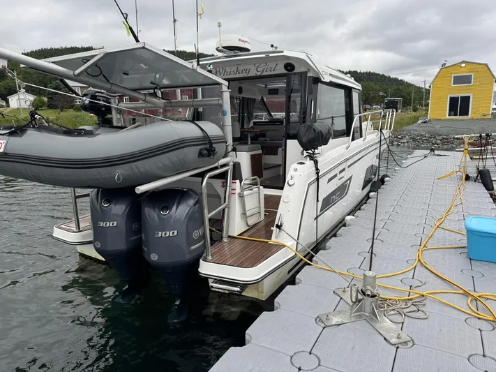  Yacht Photos Pics 2020 Jeanneau NC 1095 boat docked with dual 300 engines and inflatable dinghy.