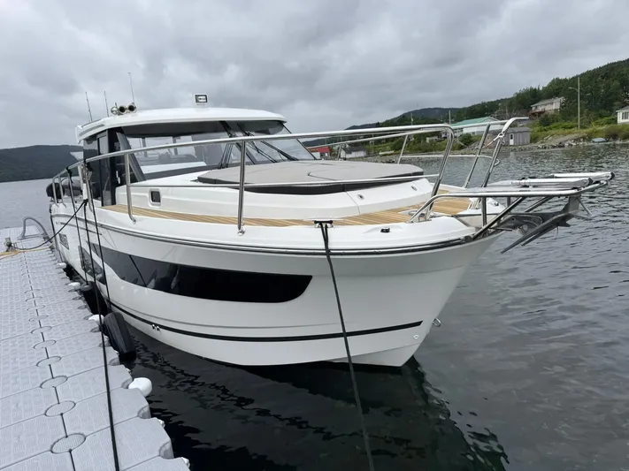  Yacht Photos Pics 2020 Jeanneau NC 1095 boat docked on a cloudy day.