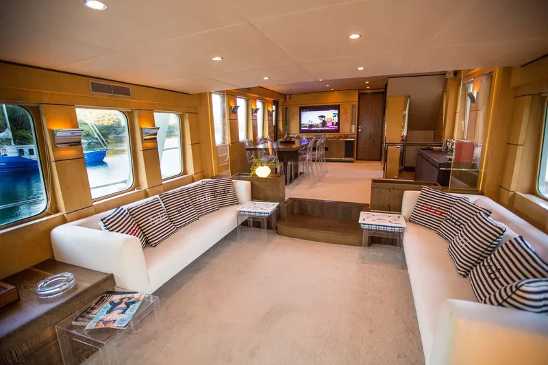Dali Yacht Photos Pics Luxurious yacht interior with modern decor, Custom 28M, 2006 model, featuring spacious seating and large windows.